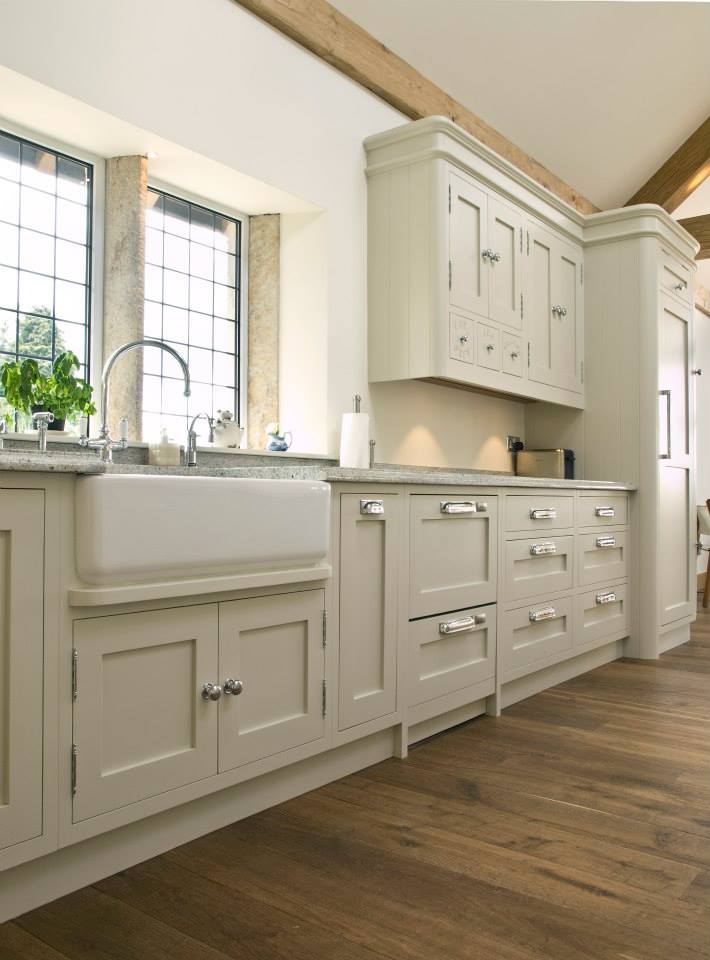 Country-style kitchen with Belfast sink and oak flooring