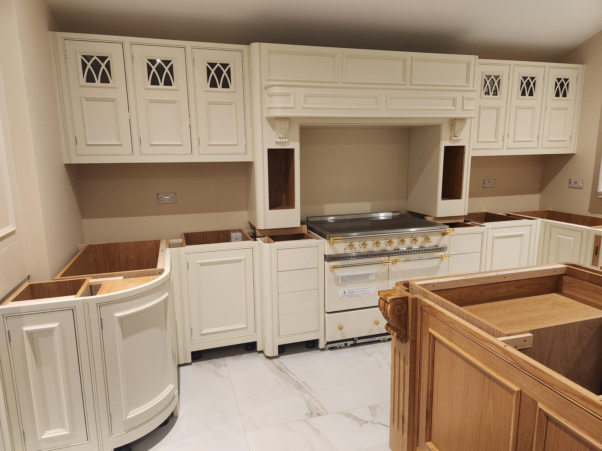 Luxury cream kitchen with La Cornue range cooker and decorative mantle hood